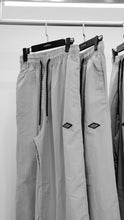 Load image into Gallery viewer, &quot;BAGGY DADDY DIAMOND NYLONS&quot; WIDELEG NYLON PANTS (GREY W/ METAL PATCH)