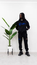 Load image into Gallery viewer, &quot;THE PLANE JANE STAPLE SET FW 25/26&quot; HOODIE (BLACK W/ ROYAL)