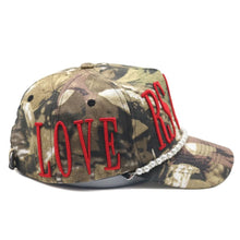 Load image into Gallery viewer, &quot;LOVERS AND FRIENDS&quot; STRAP HAT (CAMO W/ RED)