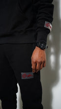Load image into Gallery viewer, &quot;THE PLANE JANE STAPLE SET FW 25/26&quot; HOODIE (BLACK W/ BLACK)