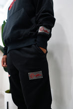 Load image into Gallery viewer, &quot;THE PLANE JANE STAPLE SET FW 25/26&quot; HOODIE (BLACK W/ RED)