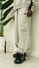Load image into Gallery viewer, &quot;BAGGY DADDY DIAMOND NYLONS&quot; WIDELEG NYLON PANTS (GREY W/ METAL PATCH)