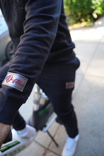 Load image into Gallery viewer, "THE PLANE JANE STAPLE SET FW 26/27" HOODIE (BLACK W/ BLACK)